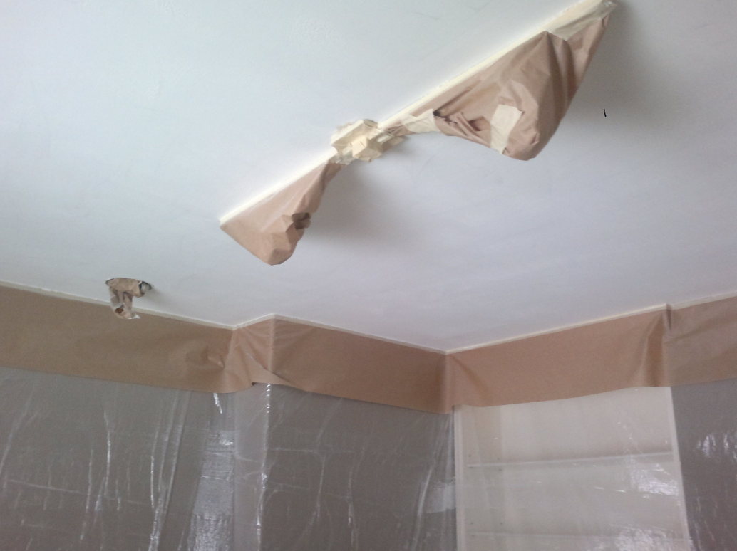 Smooth finished ceiling after protective masking