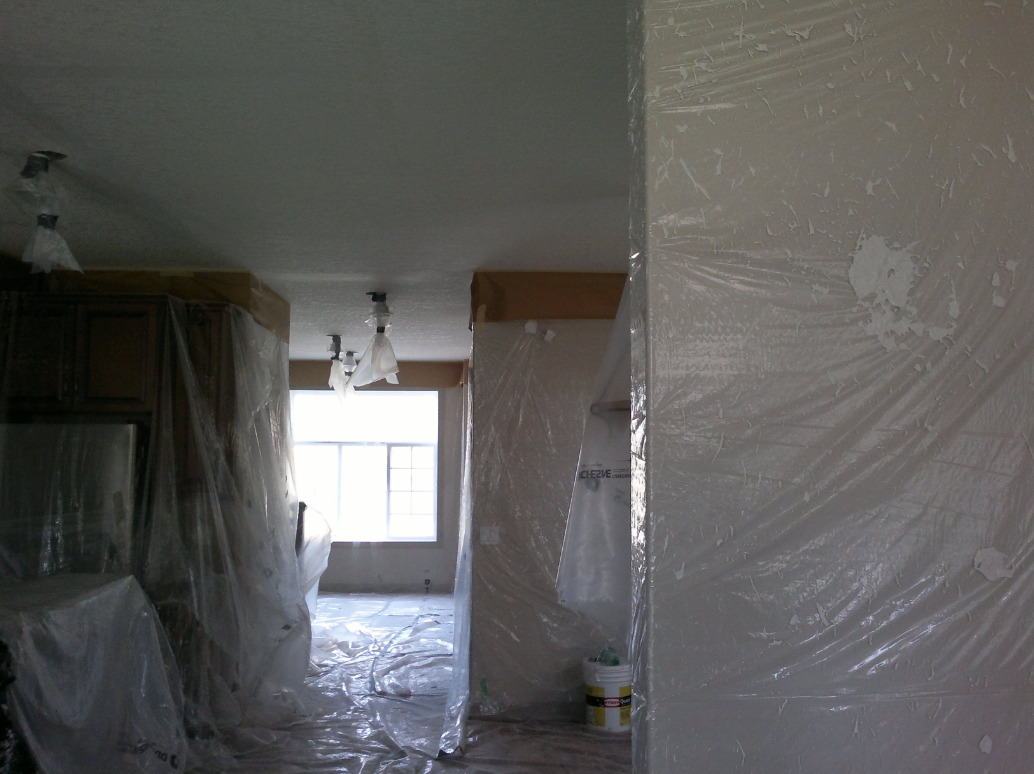 Kitchen and living area fully protected before ceiling work